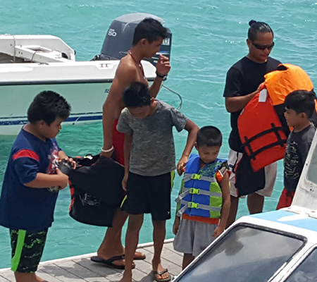 4-H Outdoor Adventures students at Tinian Dock getting ready for a marine tour 2