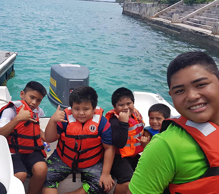 4-H Outdoor Adventures students at Tinian Dock getting ready for a marine tour