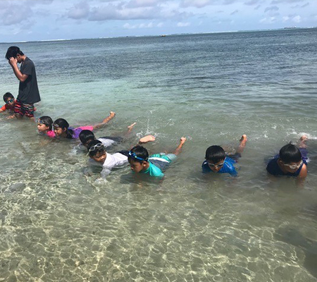 Participants learn basic swimming techniques